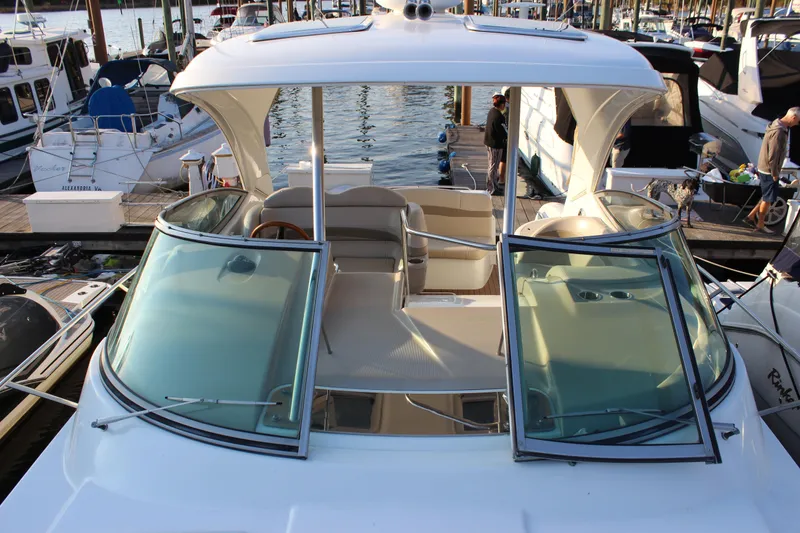 Slide: The Image of 2008 Formula 34 Performance Cruiser docked at marina, showcasing open cockpit and sleek design. - 27