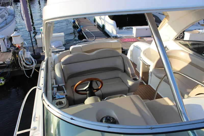 Slide: The Image of 2008 Formula 34 Performance Cruiser interior with helm, leather seating, and wooden steering wheel. - 30