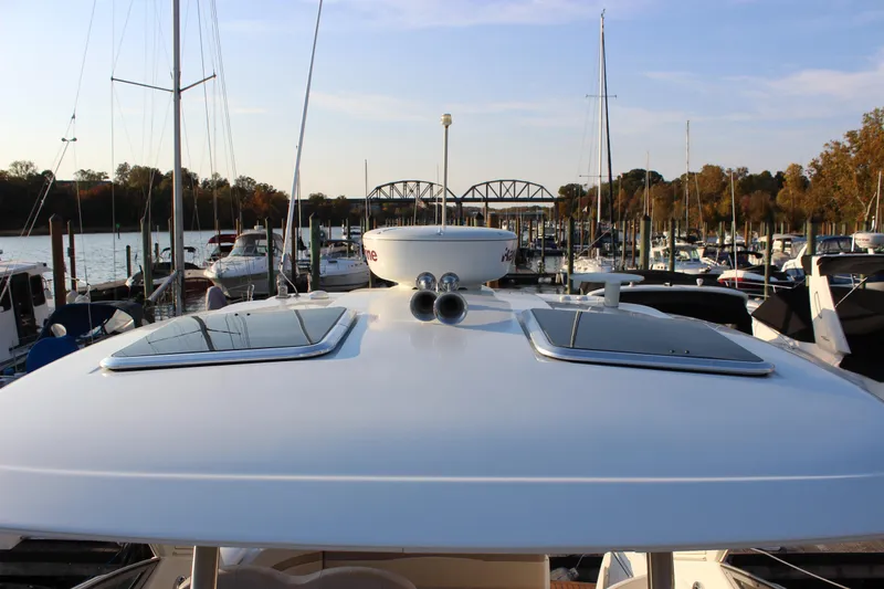 Slide: The Image of 2008 Formula 34 Performance Cruiser docked at marina, surrounded by sailboats. - 32