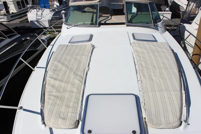Slide: The Image of 2008 Formula 34 Performance Cruiser deck with sun pads and windshield. - 33