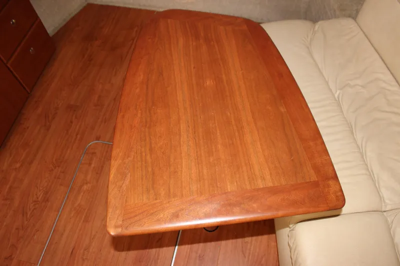 Slide: The Image of Wooden table in 2008 Formula 34 Performance Cruiser interior, next to beige seating. - 37