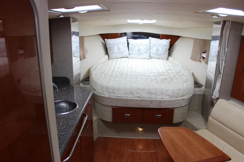 Slide: The Image of 2008 Formula 34 Performance Cruiser interior with bed, kitchenette, and seating area. - 38