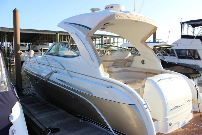 Slide: The Image of 2008 Formula 34 Performance Cruiser docked at marina, showcasing sleek design and spacious seating. - 4