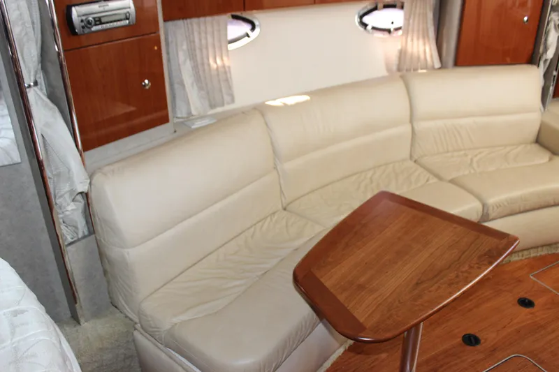 Slide: The Image of Interior of 2008 Formula 34 Performance Cruiser with beige leather seating and wooden table. - 40