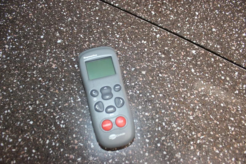 Slide: The Image of Remote control on speckled countertop, related to 2008 Formula 34 Performance Cruiser. - 44