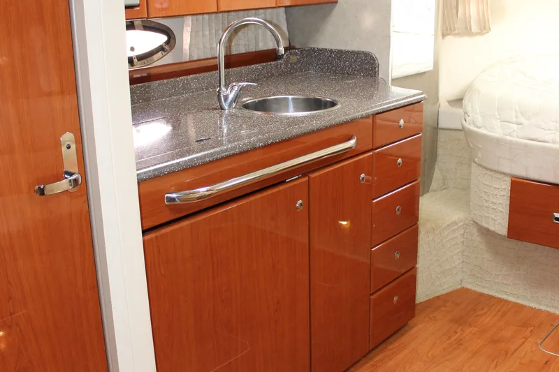Slide: The Image of 2008 Formula 34 Performance Cruiser interior with sleek wood cabinetry and modern sink. - 49