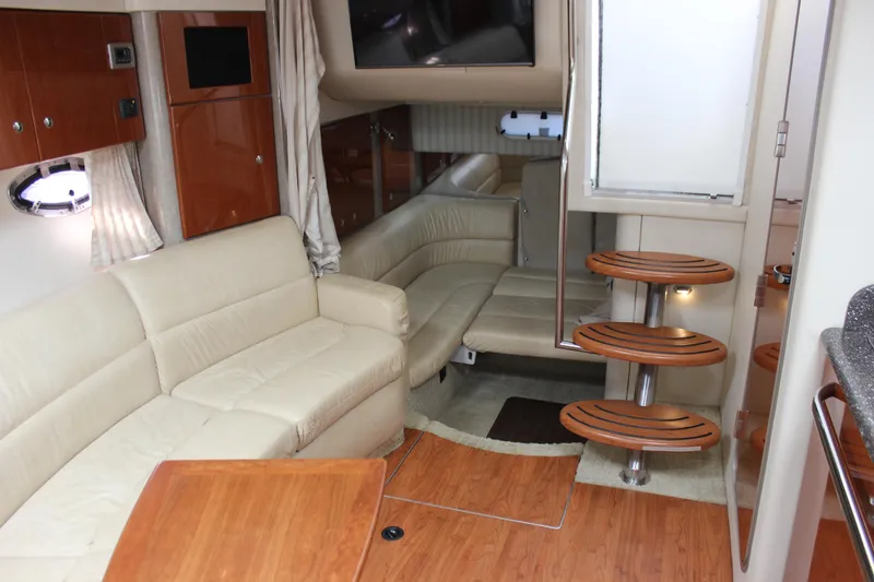 Slide: The Image of Interior of 2008 Formula 34 Performance Cruiser with beige seating and wooden accents. - 52