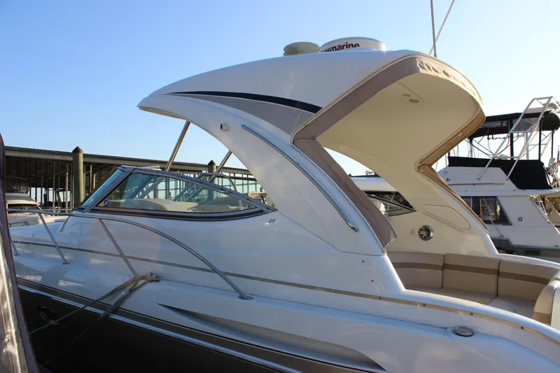 Slide: The Image of 2008 Formula 34 Performance Cruiser docked at marina under clear blue sky. - 6
