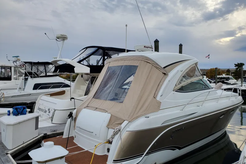Slide: The Image of 2008 Formula 34 Performance Cruiser docked at marina under cloudy sky. - 64