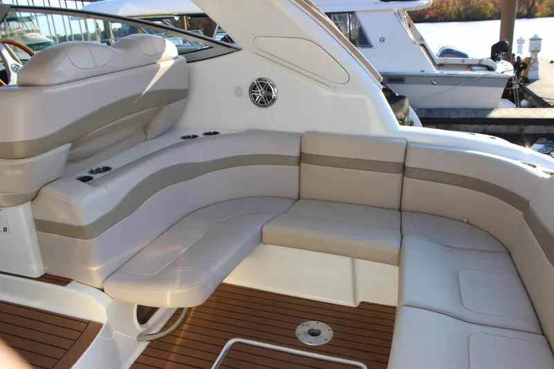 Slide: The Image of 2008 Formula 34 Performance Cruiser interior with beige seating and wood flooring. - 7