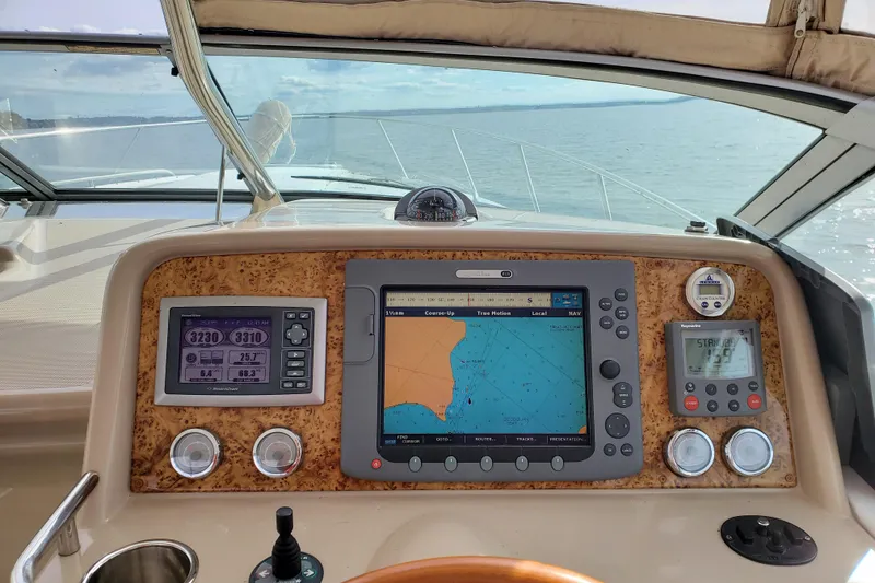 Slide: The Image of Control panel of a 2008 Formula 34 Performance Cruiser with navigation screens. - 71