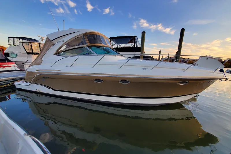 Slide: The Image of 2008 Formula 34 Performance Cruiser docked at sunset, showcasing sleek design and luxury features. - 72