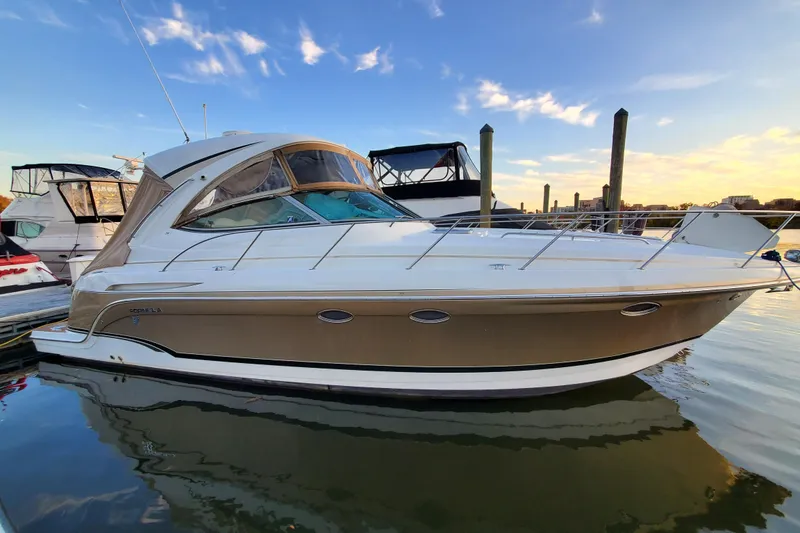 Slide: The Image of 2008 Formula 34 Performance Cruiser docked at sunset, reflecting on calm water. - 74