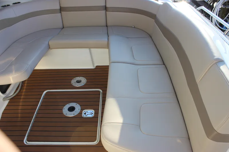 Slide: The Image of 2008 Formula 34 Performance Cruiser interior with beige seating and teak flooring. - 8
