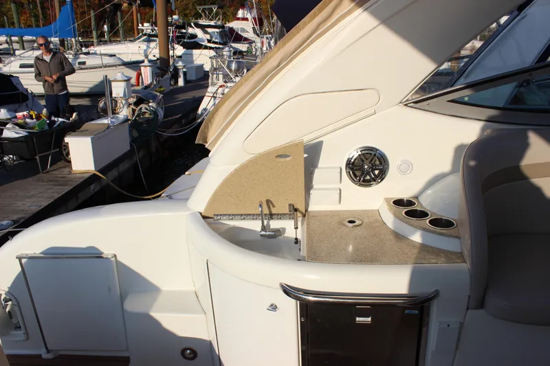 Slide: The Image of 2008 Formula 34 Performance Cruiser yacht interior with sink and seating area at marina. - 9