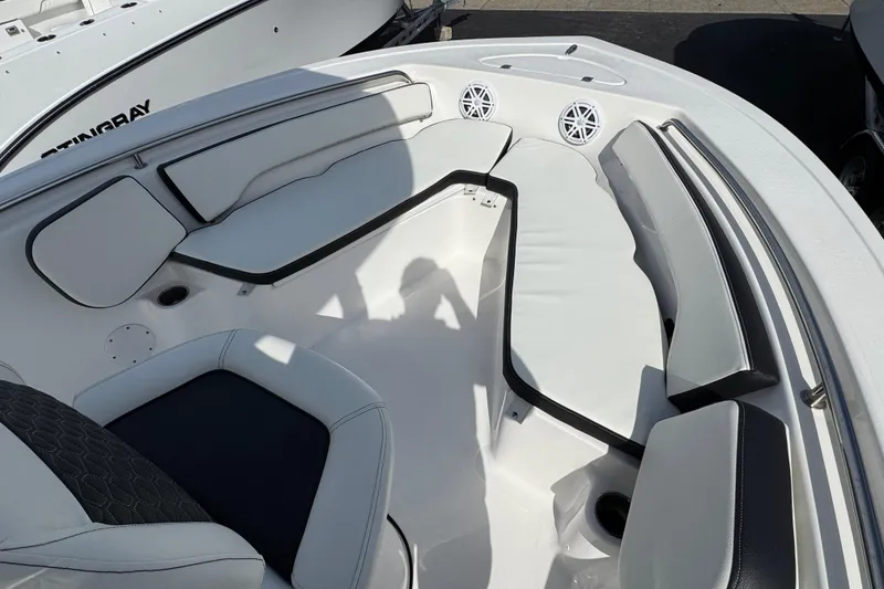 Slide: The Image of 2024 Tidewater 198 CC Adventure boat interior with cushioned seating and speakers. - 11