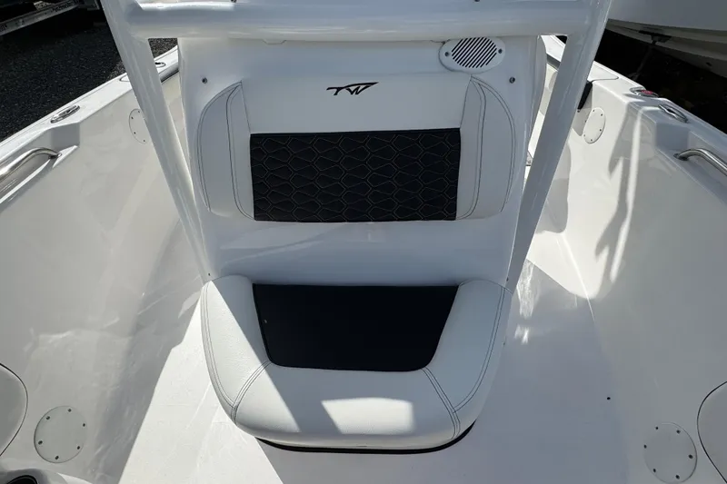 Slide: The Image of 2024 Tidewater 198 CC Adventure boat seat with black and white upholstery. - 12