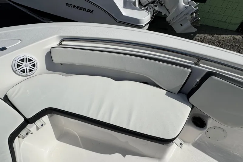 Slide: The Image of 2024 Tidewater 198 CC Adventure boat interior with cushioned seating and speaker. - 14