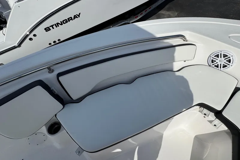 Slide: The Image of 2024 Tidewater 198 CC Adventure boat interior with cushioned seating and speaker. - 15