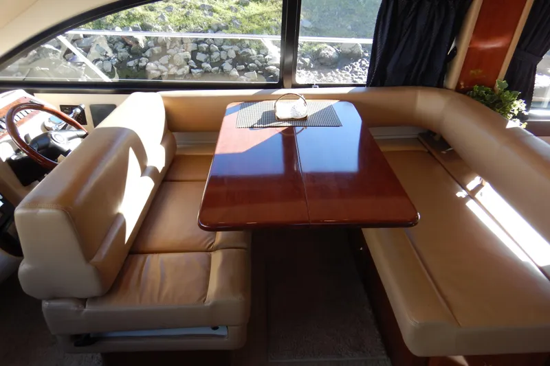 Slide: The Image of Interior of 2008 Meridian 411 Sedan with elegant dining area and leather seating. - 14