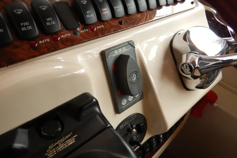 Slide: The Image of Control panel of a 2008 Meridian 411 Sedan boat with switches and throttle. - 19