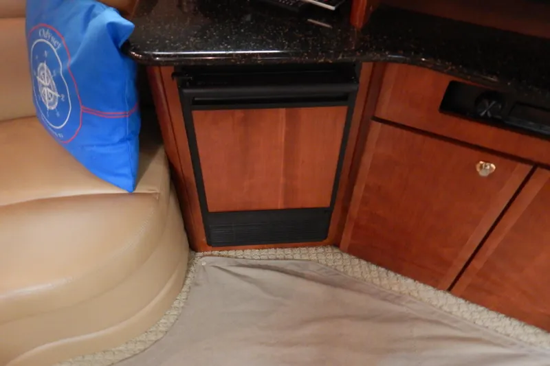 Slide: The Image of Interior of 2008 Meridian 411 Sedan with wood cabinetry and blue cushion. - 21