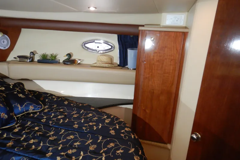 Slide: The Image of Luxurious interior of 2008 Meridian 411 Sedan with elegant bedding and wooden cabinetry. - 26