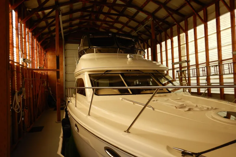 Slide: The Image of 2008 Meridian 411 Sedan yacht stored in a wooden boathouse. - 3