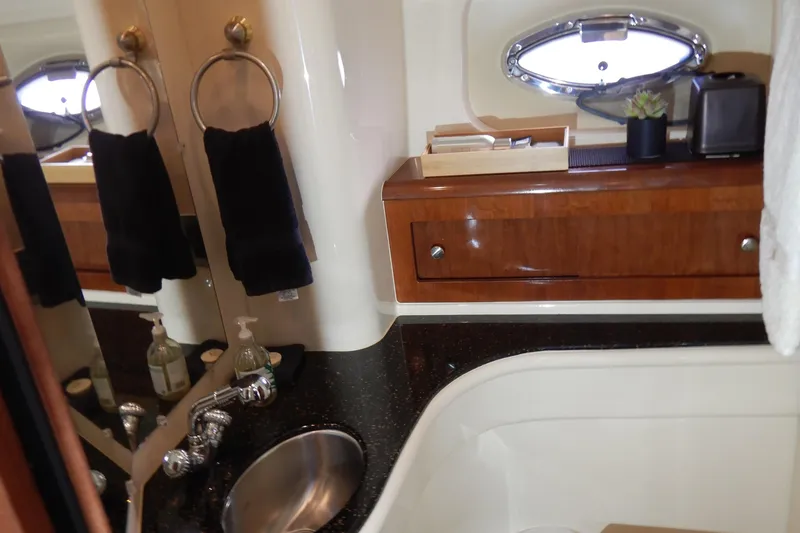 Slide: The Image of Luxurious bathroom interior of 2008 Meridian 411 Sedan yacht with sink and wooden cabinetry. - 31
