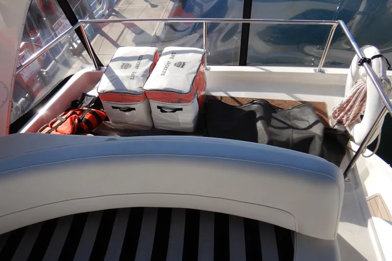 Slide: The Image of 2008 Meridian 411 Sedan boat deck with life jackets and safety equipment. - 37
