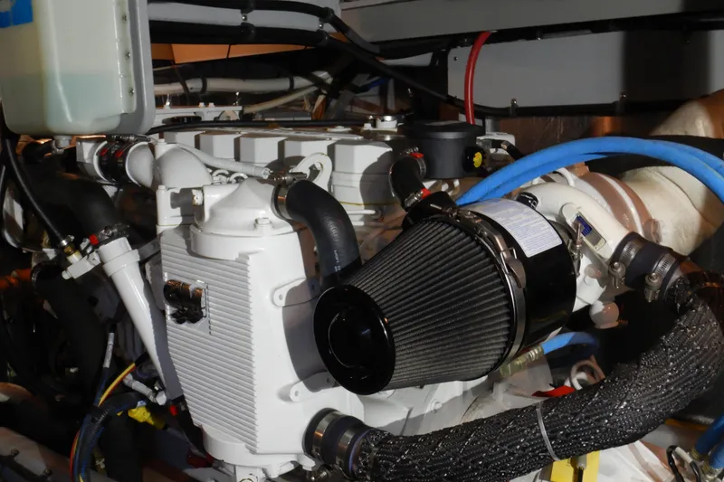 Slide: The Image of Engine compartment of a 2008 Meridian 411 Sedan with visible components and hoses. - 42
