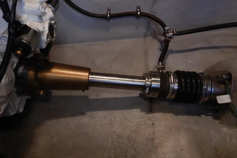 Slide: The Image of 2008 Meridian 411 Sedan engine component with metal shaft and hoses. - 47