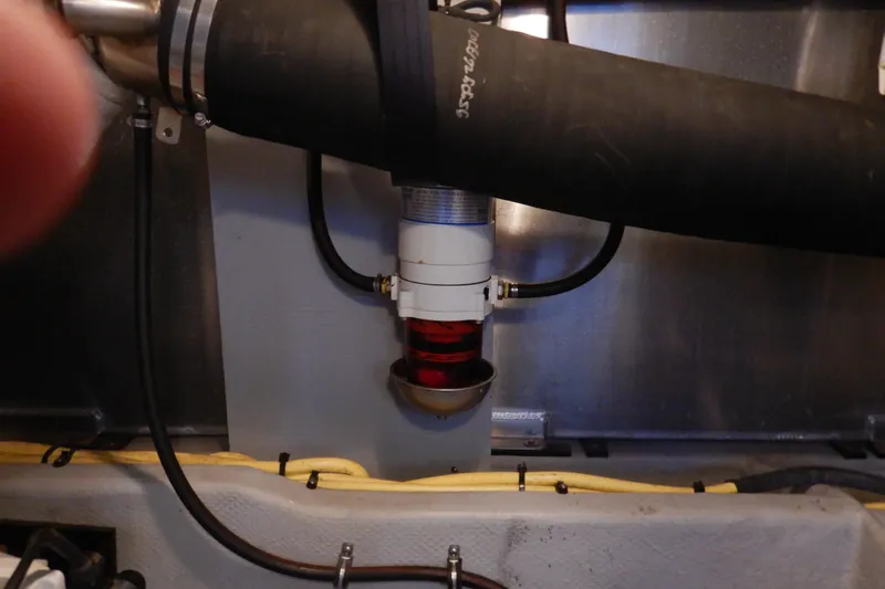 Slide: The Image of Engine compartment of 2008 Meridian 411 Sedan with visible hoses and fittings. - 48