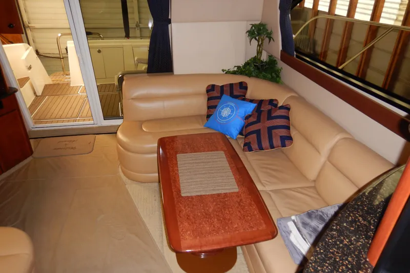 Slide: The Image of Luxurious interior of 2008 Meridian 411 Sedan with beige leather seating and decorative pillows. - 8