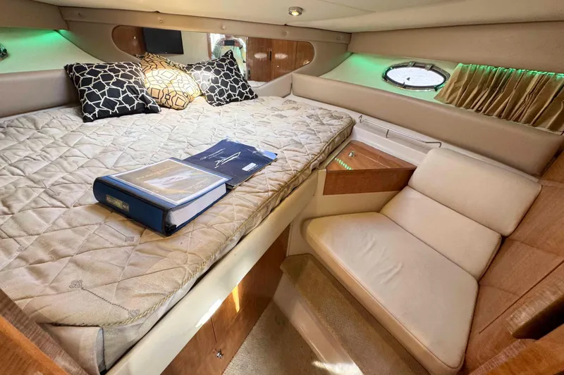 Slide: The Image of Luxurious cabin interior of 2004 Regal Commodore 3560 yacht with cozy bed and seating. - 26