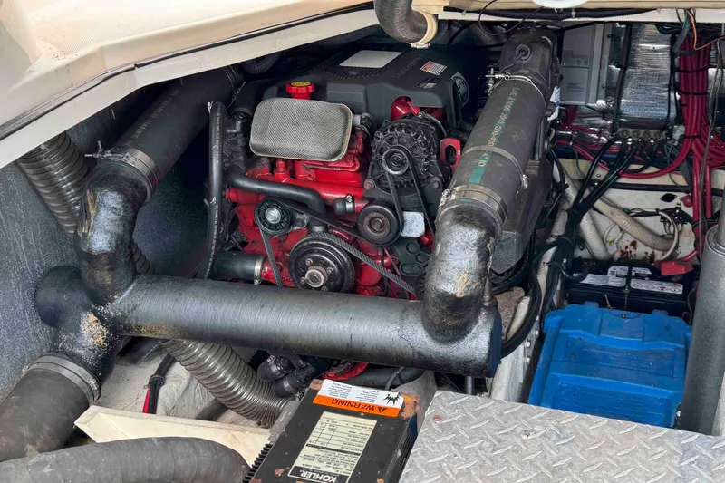 Slide: The Image of Engine compartment of a 2004 Regal Commodore 3560 boat, showcasing mechanical components. - 32