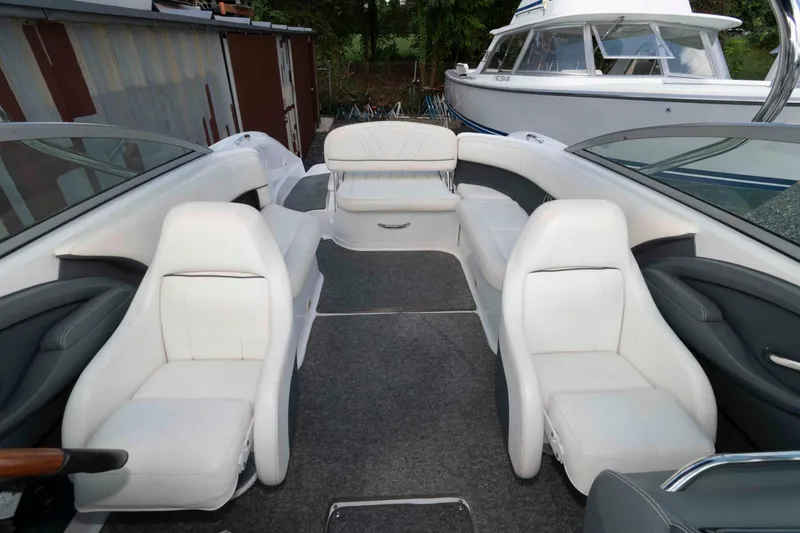 Slide: The Image of 2007 Cobalt 252 boat interior with white seating and spacious layout. - 6