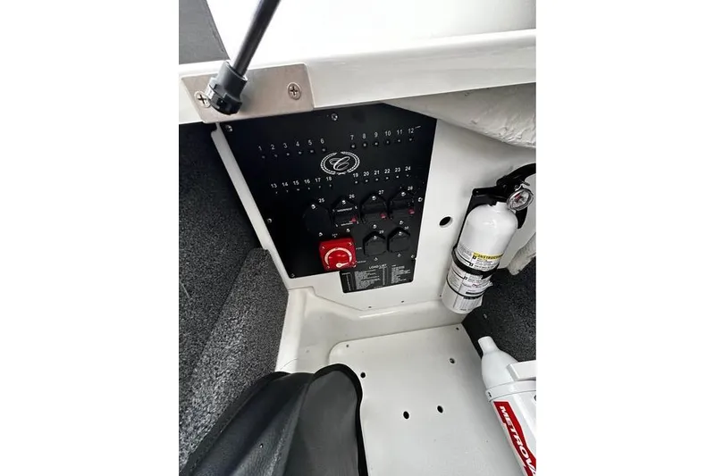 Slide: The Image of 2023 Cobalt R8 boat dashboard with navigation screens and steering wheel. - 13