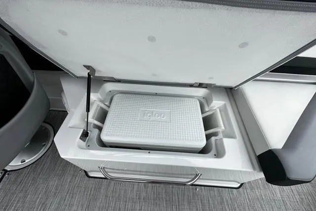 Slide: The Image of 2023 Cobalt R8 boat with built-in Igloo cooler storage compartment. - 24