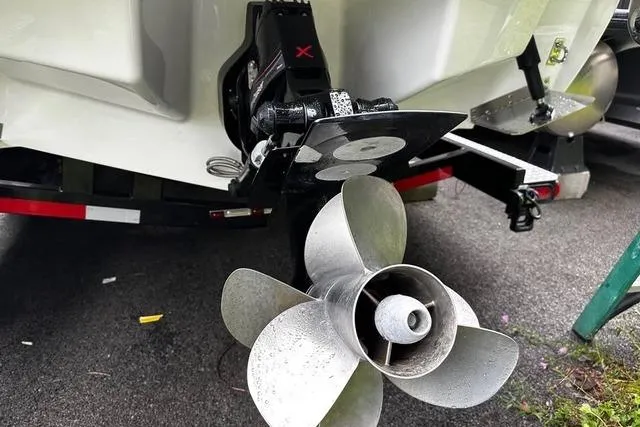 Slide: The Image of 2023 Cobalt R8 boat propeller and stern drive on a trailer. - 32
