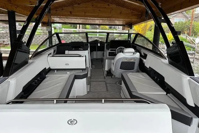 Slide: The Image of 2023 Cobalt R8 boat covered at a dock, calm water, sunny day. - 4