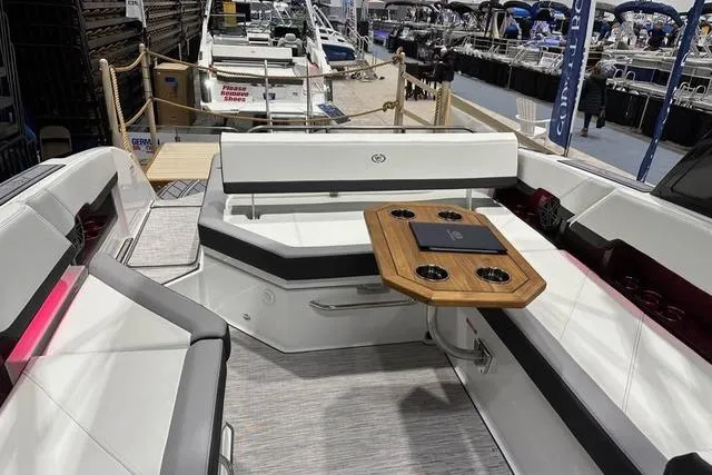 Slide: The Image of 2023 Cobalt R8 boat on trailer, parked on a sunny street with cloudy sky. - 6