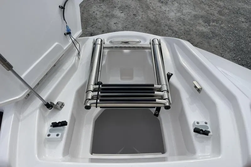 Slide: The Image of 2023 Yamaha Boats 252SD swim platform with retractable ladder and storage compartment. - 13