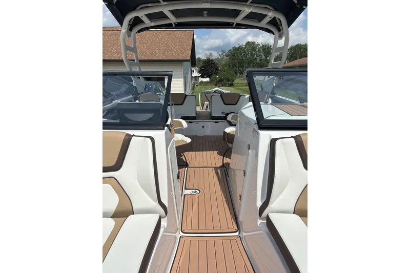 Slide: The Image of 2023 Yamaha Boats 252SD interior with tan seating and sleek design. - 15