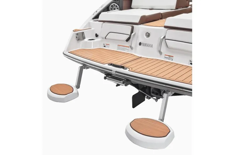 Slide: The Image of 2023 Yamaha Boats 252SD interior with tan seating and sleek design. - 4
