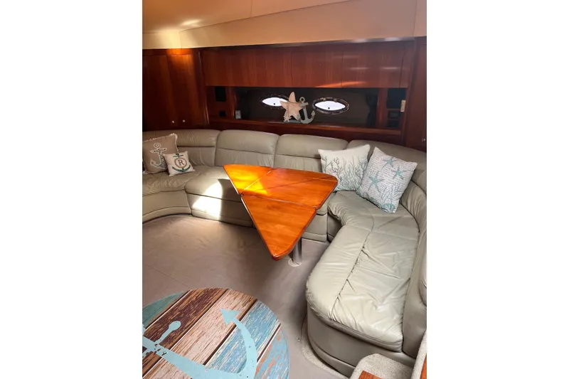 Slide: The Image of Luxurious 2006 Cruisers Yachts 520 Express interior with leather seating and decorative pillows. - 10