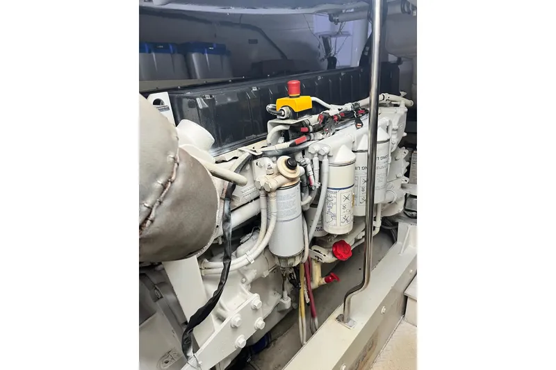 Slide: The Image of Engine compartment of 2006 Cruisers Yachts 520 Express, showcasing detailed mechanical components. - 16