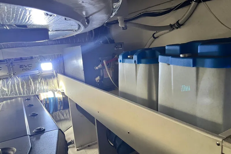 Slide: The Image of Engine room of 2006 Cruisers Yachts 520 Express, featuring batteries and EVC PCU components. - 20