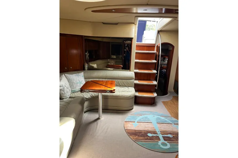 Slide: The Image of Luxurious interior of 2006 Cruisers Yachts 520 Express with elegant seating and wooden accents. - 6