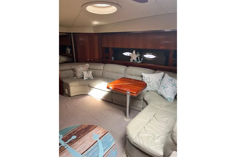 Slide: The Image of Luxurious interior of 2006 Cruisers Yachts 520 Express with plush seating and nautical decor. - 7